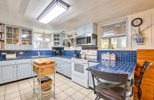 Sunset Cove House | Vintage lakefront mountain home with boat house, dock, firepit & fireplace