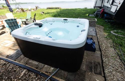 Spring Grove House | Waterfront 2BR Nautical Cottage on Grass Lake Hot Tub Firepit Year Round Fun