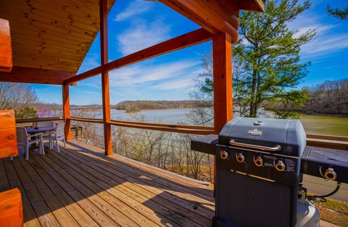 Eddyville Cabin | Waterfront Sunrise Bay Log Cabin - Lake Barkley Log is your perfect family escape on Lake Barkley! This charming log cabin offers two bedrooms, a sleeping loft, full kitchen, and bathroom with shower.
