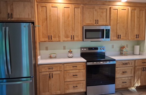 Palmyra House | Whispering Pines is a lovely 3-bedroom family-friendly home in a wooded setting.