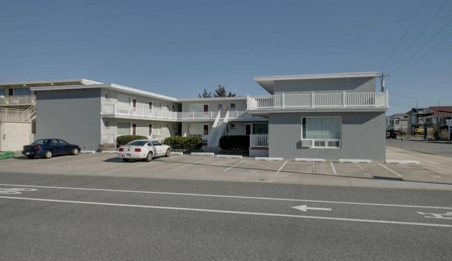 1st Floor Front Efficiency Unit, right side, corner Tables and chairs in the court yard. in Stone Harbor