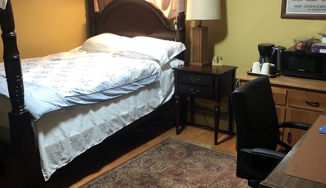 Bedroom with private full bathroom, linen and towels are provided.