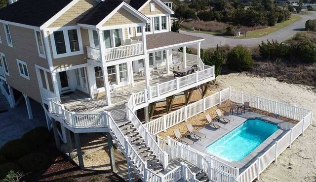 Enjoy panoramic views in “Breezy Point,” a five-bedroom home with a private pool in Dunescape.
