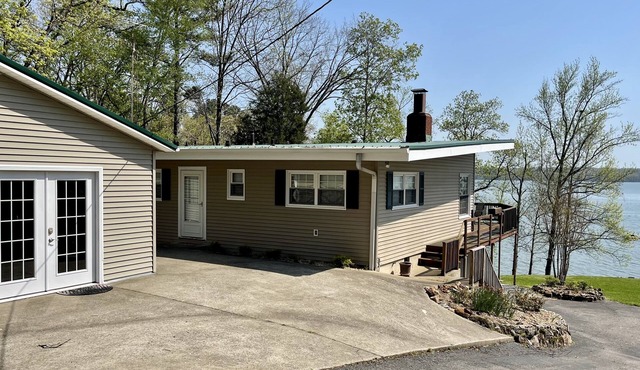 Experience Kentucky Lake out the back door! Spacious 4-bedroom retreat awaits.