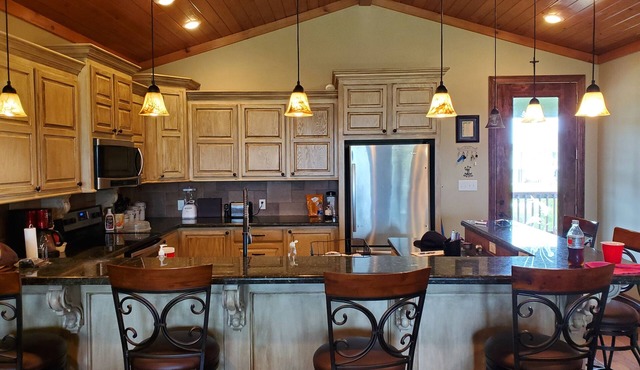 Lovely 4-bedroom elevated house with Front and Back Porches, on a canal in Hackberry