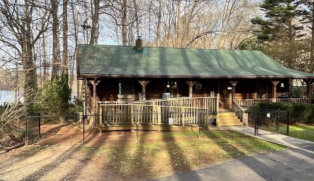 Peaceful 5-bedroom, 3-bathroom lake front cabin with 2 porches for relaxing.