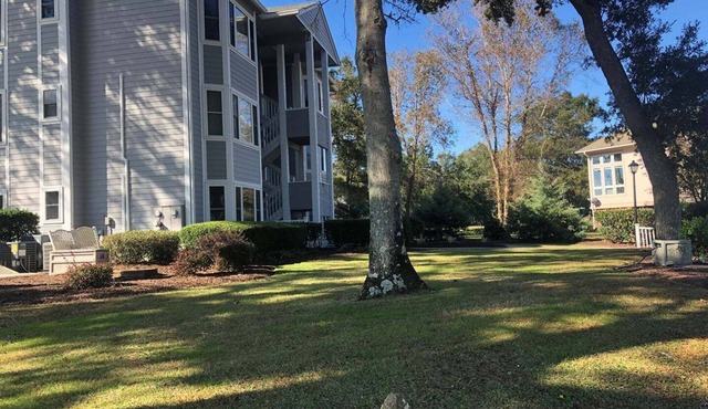 Relax at Holden Hideaway—a 2BR condo near the beautiful Lockwood Folly Golf Course.
