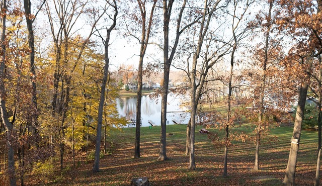 Second floor condo with views of the lake, walking trails & shared garage