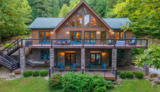 Spacious waterfront property with deck, hot tub, fireplace, & central AC