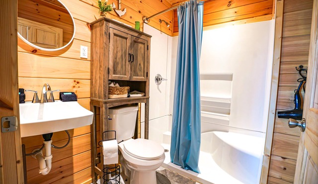 Waterfront Sunrise Bay Log Cabin - Lake Barkley Log is your perfect family escape on Lake Barkley! This charming log cabin offers two bedrooms, a sleeping loft, full kitchen, and bathroom with shower.
